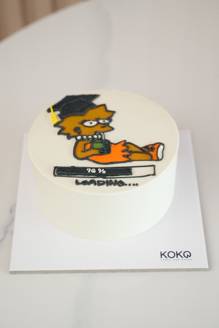 Loading graduate bento cake